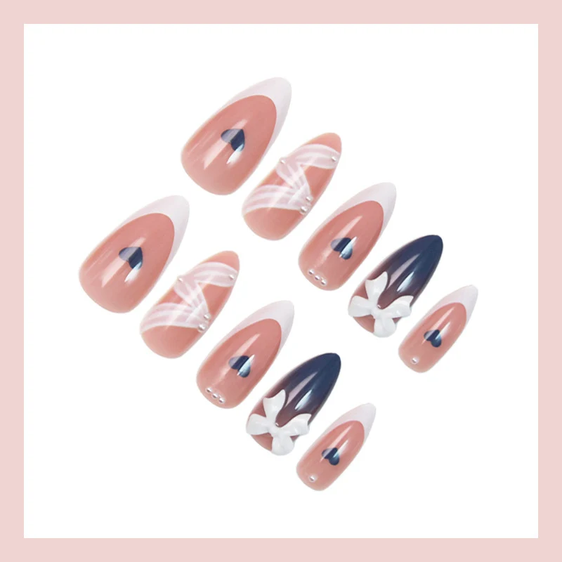 Kunstnagelset mit eleganten Schleifen und herzförmigen Akzenten Brehn