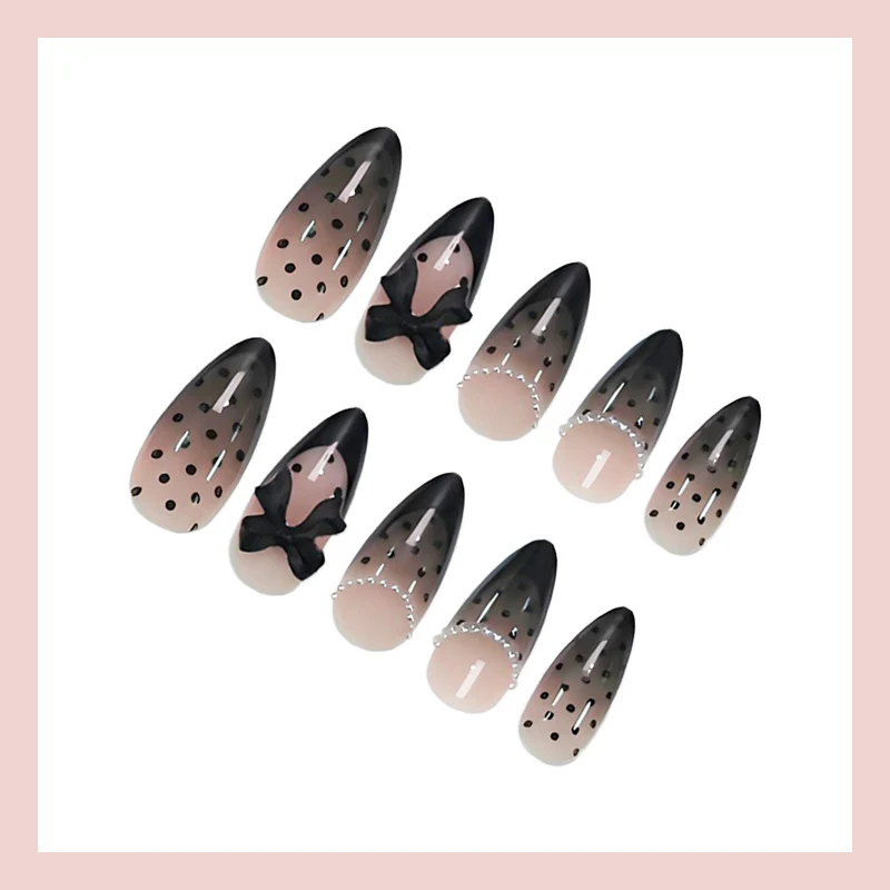 Kunstnagelset mit elegantem Punkt- und Schleifenmuster Brehn