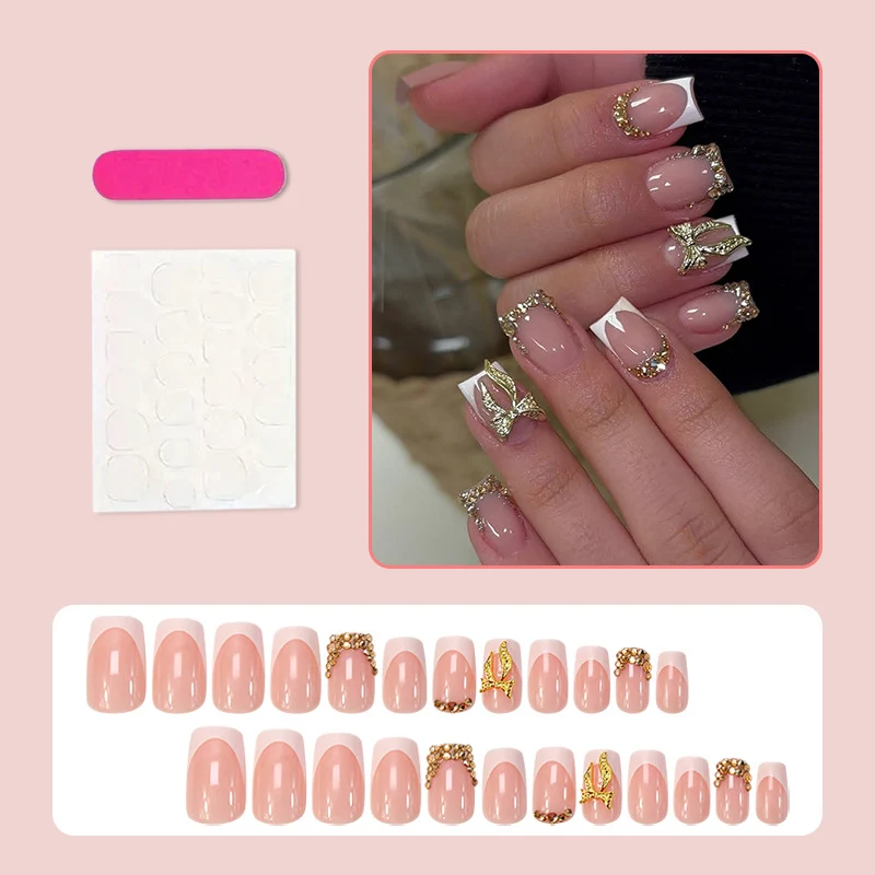 Kunstnagelset mit eleganten Glitzerornamenten und stilvollen French-Tipps Brehn