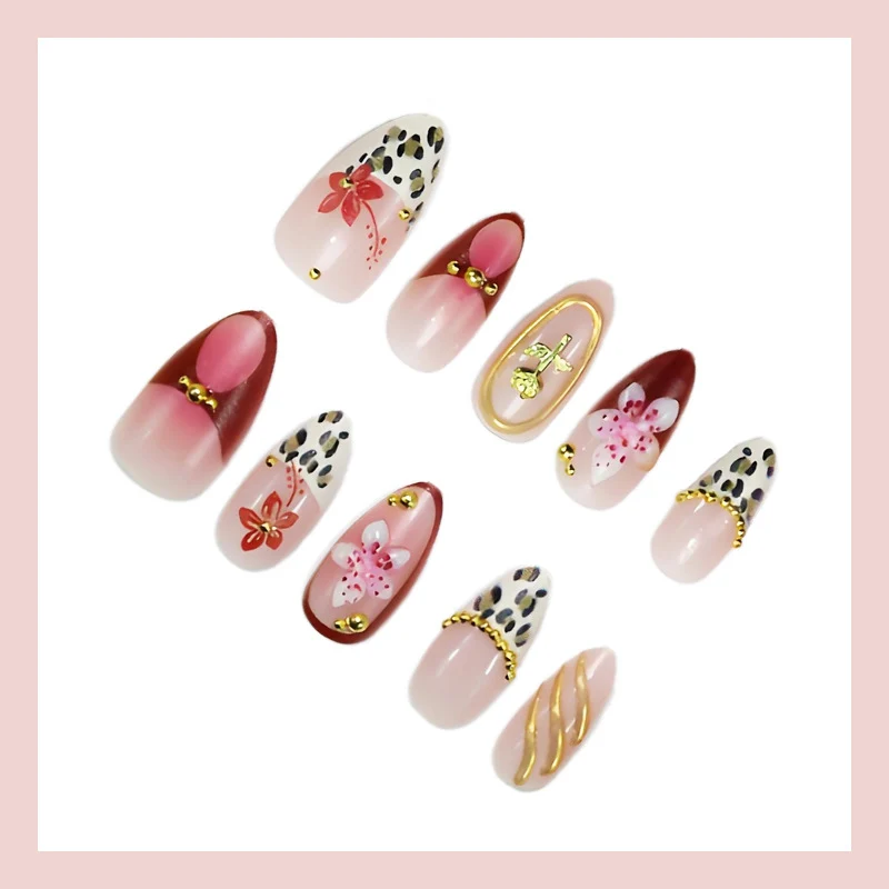 Kunstnagelset mit eleganten floralen und tierischen Akzenten Brehn