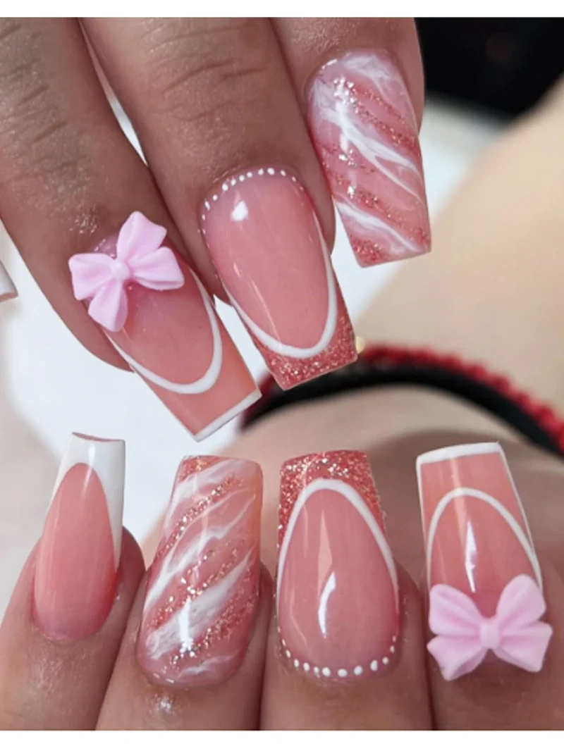 Kunstnagelset mit elegantem Glitzer-Design und verspielten Schleifen akzenten Brehn