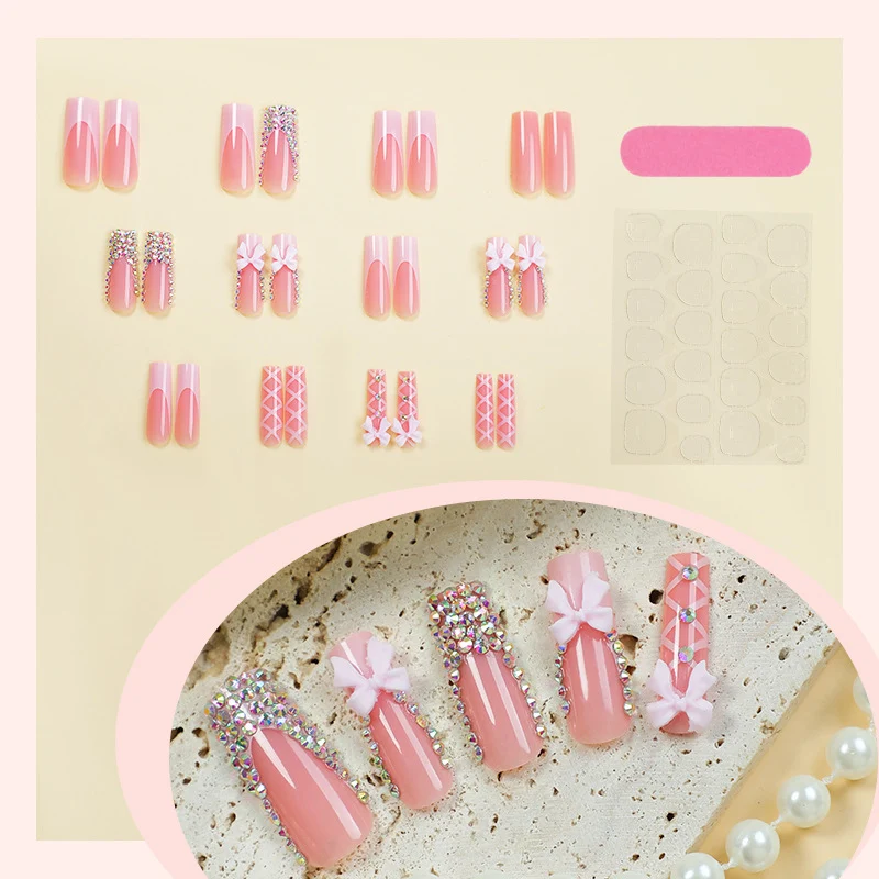 Kunstnagelset mit eleganten Schleifen- und Glitzerakzenten Brehn