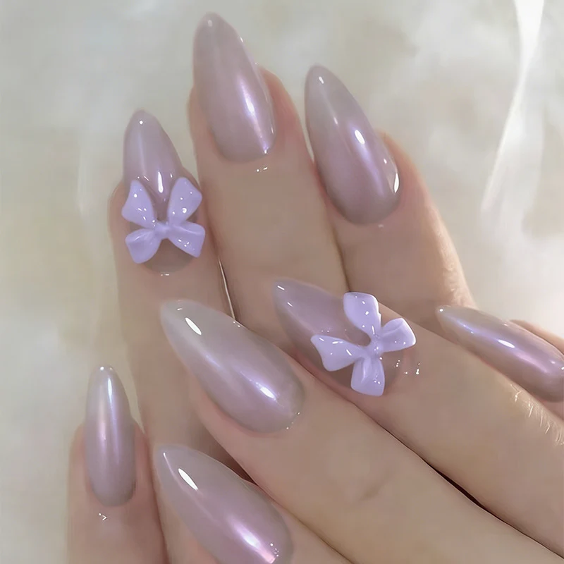 Kunstnagelset mit eleganten Schleifchen und sanftem Design Brehn