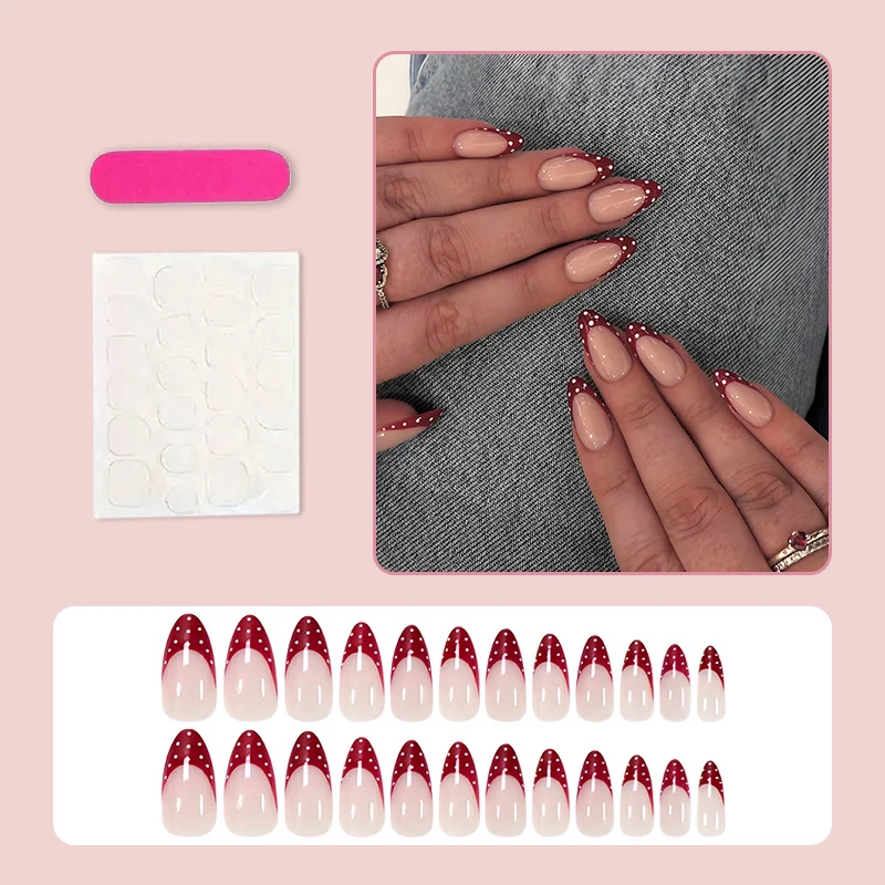 Kunstnagelset mit eleganten roten Spitzen und verspielten Punkten Brehn