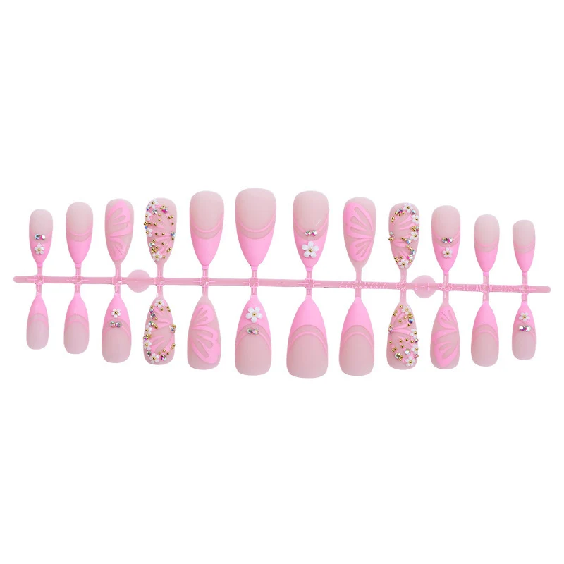 Kunstnagelset mit eleganten Blüten- und Glitzerverzierungen Brehn