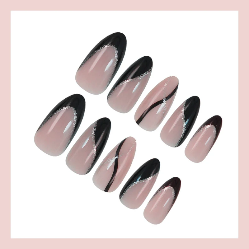 Kunstnagelset mit elegantem Schwarzweiß-Design und Glitzerakzenten Brehn