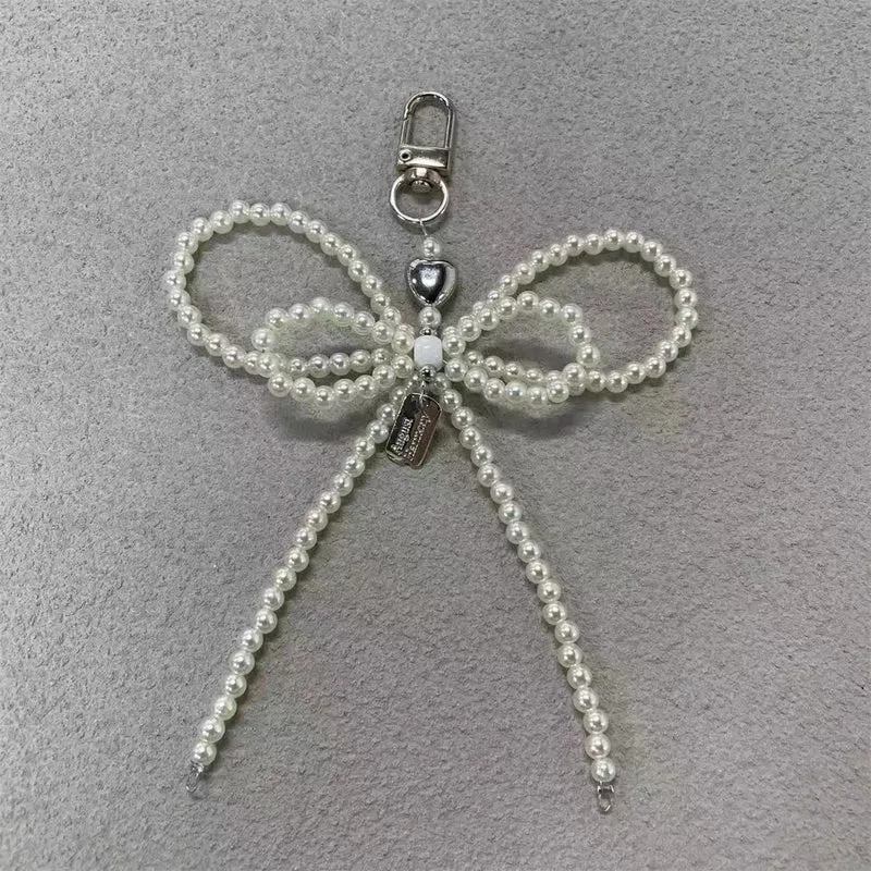 Elegante Perlenbogen Schlüsselanhänger Brehn