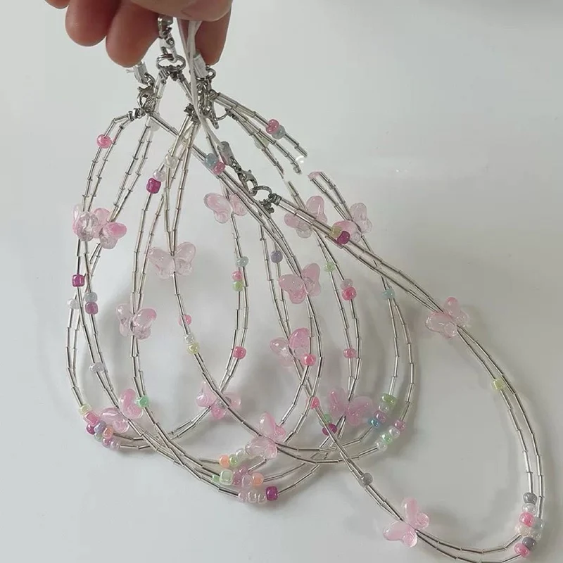 Dekorativer Schmetterlings Charm Brillenband Brehn
