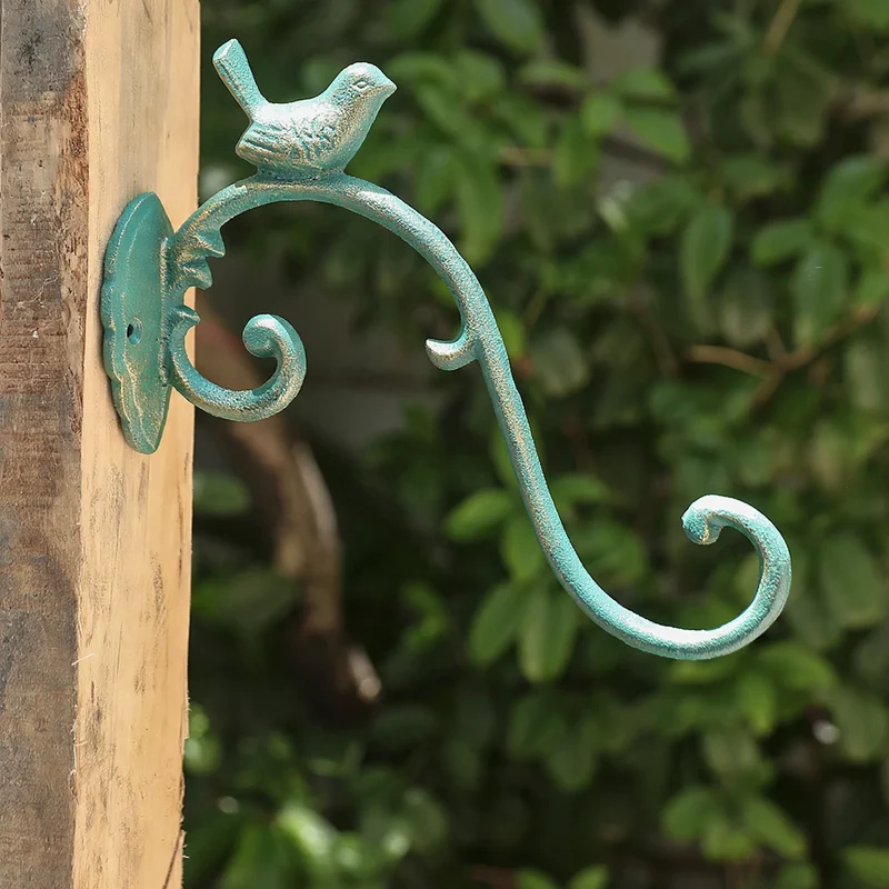 Gusseiserner Wandhaken mit Vogelmotiv