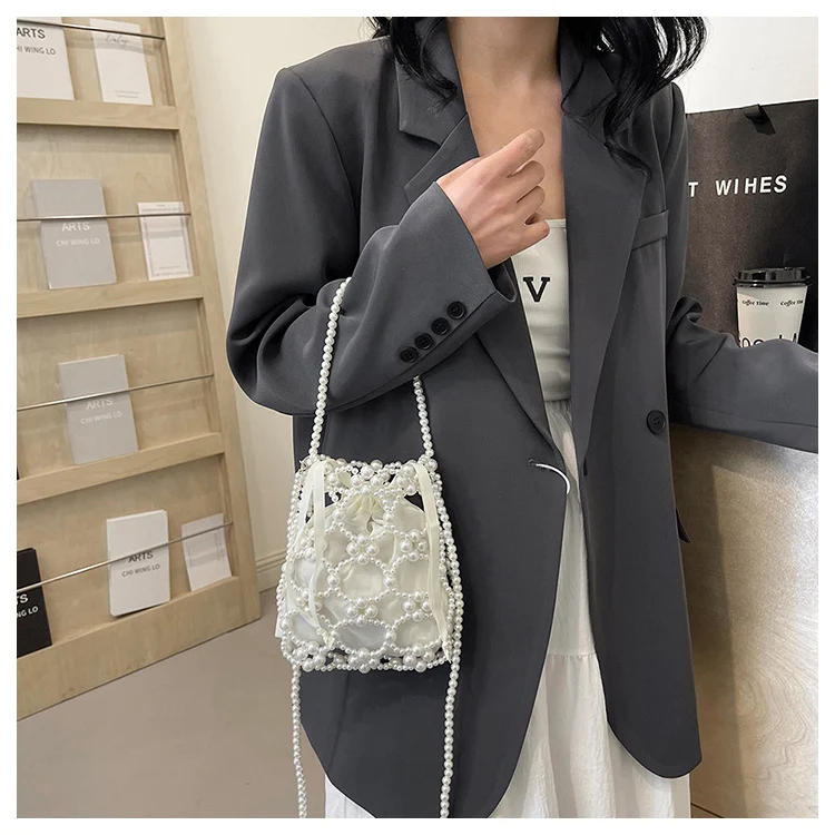 Elegante perlenverzierte Drawstring-Handtasche